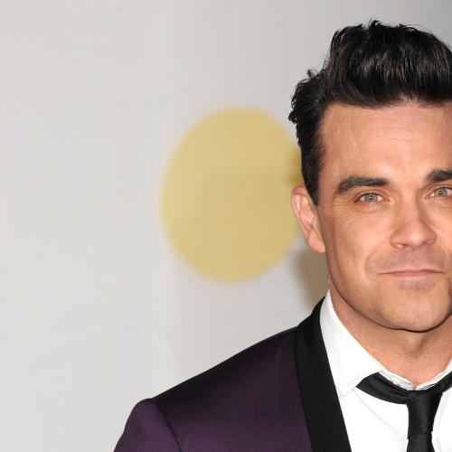 Robbie Williams Caught Disinfecting Hands After Touching Fan